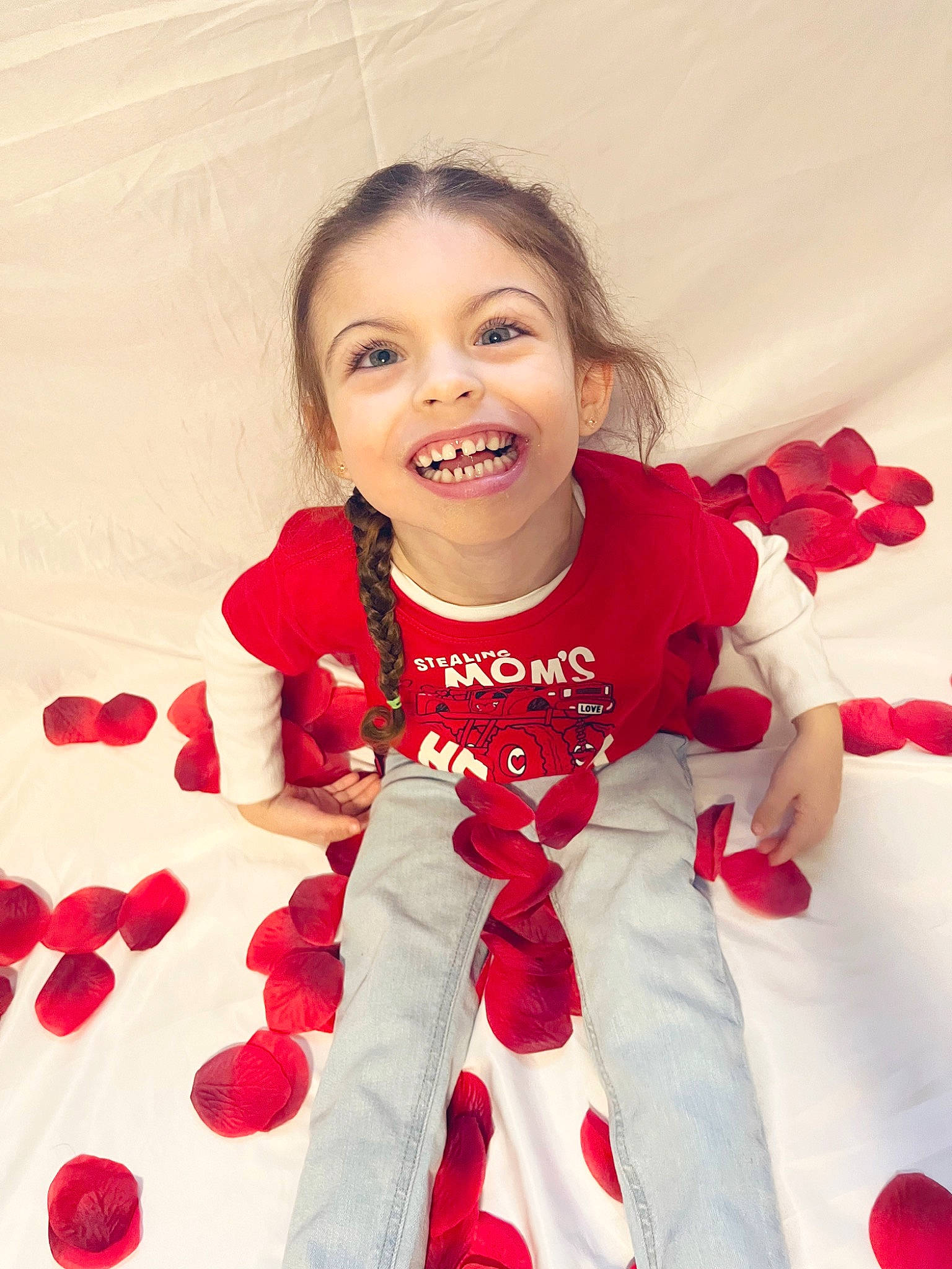 Mckenzie is registered to the contest to win money with this photo: baby_toddler_clothing, carmine, child, event, eye, face, fictional_character, finger, flooring, fun, gesture, happy, joy, pattern, person, petal, play, red, sleeve, smile