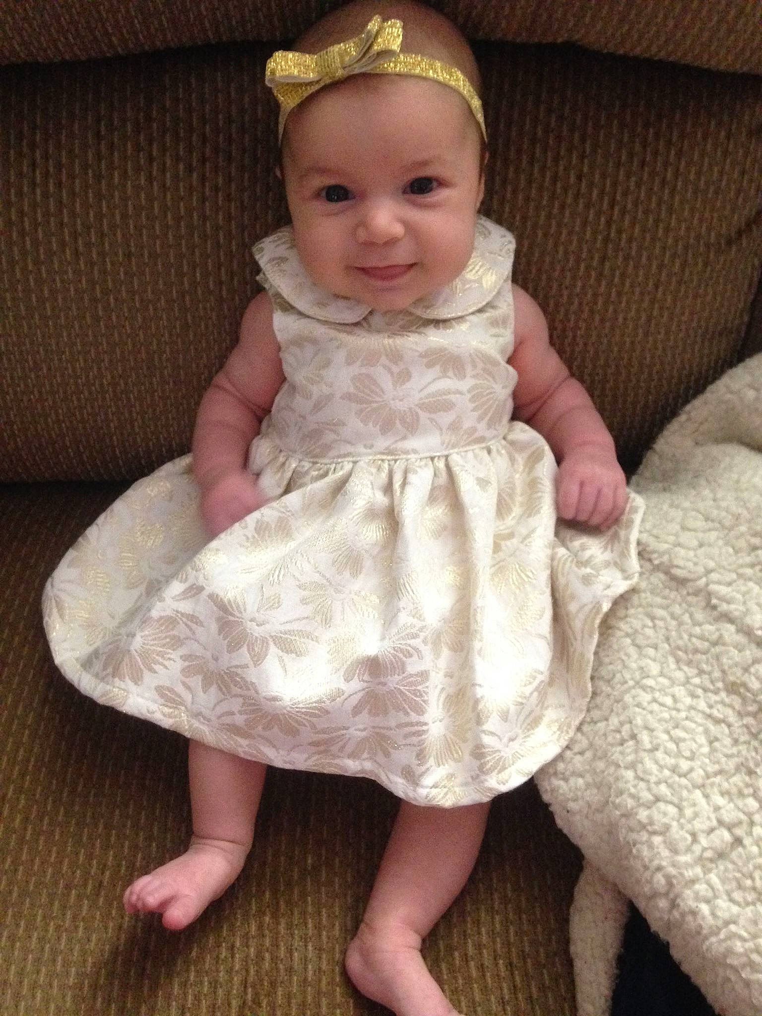 Olivia is registered to the contest to win money with this photo: child, dress, girl, gown, hair_accessory, headgear, headpiece, human_hair_color, infant, iris, lace, material, person, product, skin, textile, toddler