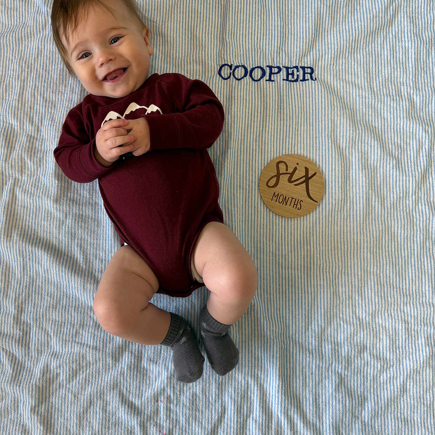 Cooper joined the competition — help win amazing prizes! baby, bodypart, clothing, face, finger, hand, happy, head, hosiery, knitwear, longsleeve, pants, person, photography, portrait, sitting, sleeve, smile, sock, sweater