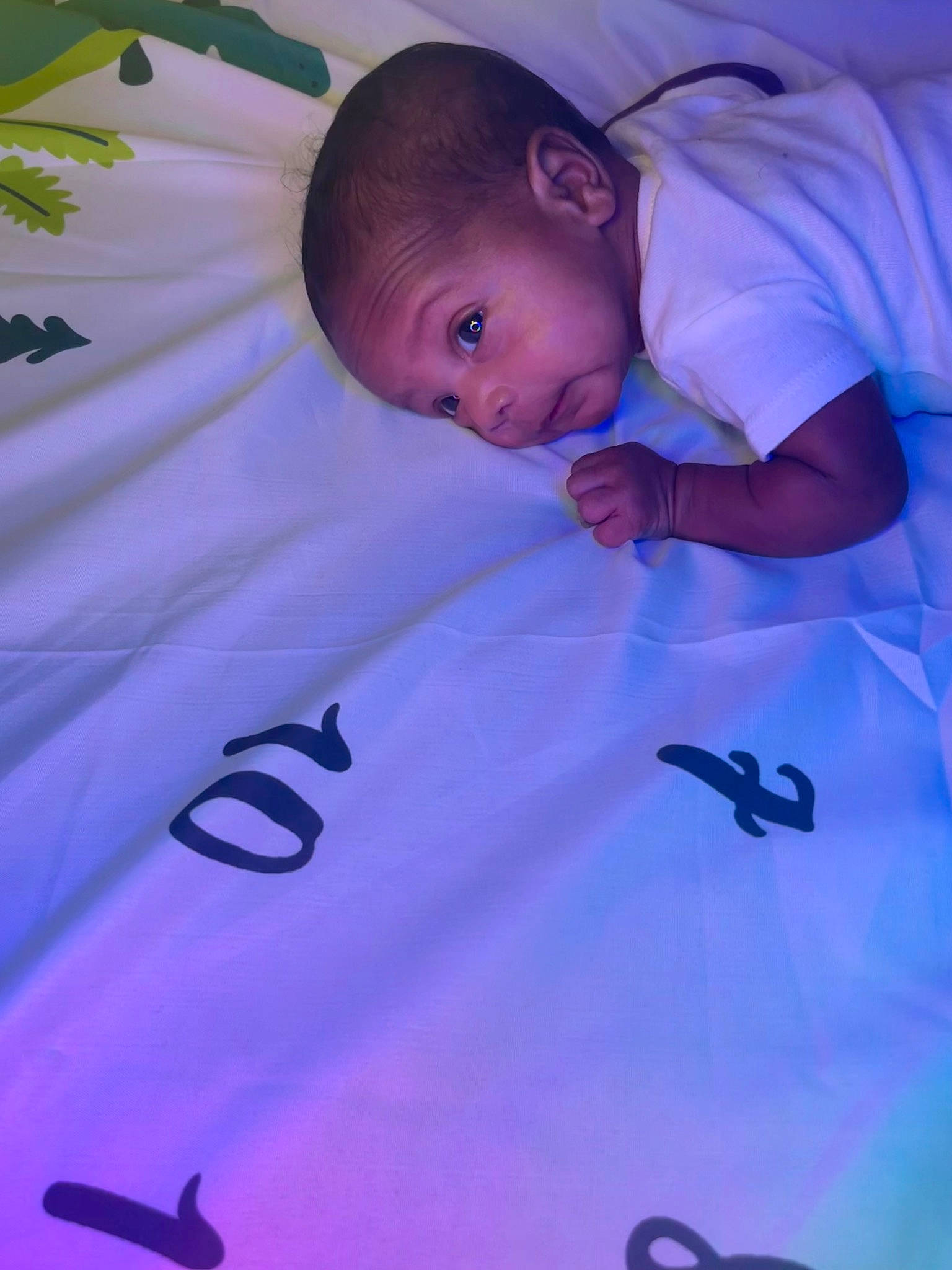 Braylen is registered to the contest to win money with this photo: azure, baby, baby_products, baby_safety, baby_toddler_clothing, bedding, bedtime, child, comfort, electric_blue, fun, happy, infant_bed, linens, magenta, person, purple, room, textile, toddler