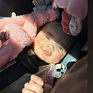 Ahmayah joined the competition — help win amazing prizes! baby, blue_eyes, car_seat, child, cute, emoji_overlay, expression, face, fluffy_clothing, hand, happy, indoors, infant, pacifier, pink_jacket, portrait, seatbelt, skin, sunlight, young