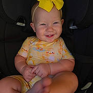 Alruna is registered to the contest to win money with this photo: baby, baby_girl, car_seat, child, closeup, clothing, cute, cute_outfit, duck_pattern, foot, graco, hand, happy, headband, indoor, infant, portrait, seatbelt, smiling, yellow_bow