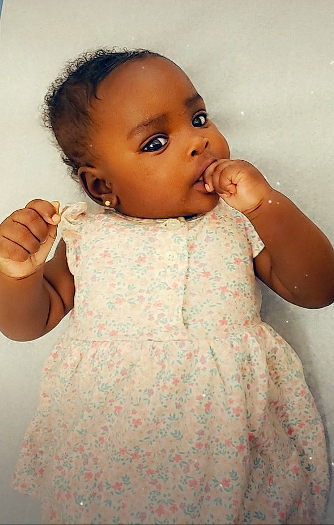 Diana is registered to the contest to win money with this photo: abdomen, baby, cheek, child, ear, eye, face, forehead, head, iris, lip, neck, nose, person, pink, skin, toddler, trunk