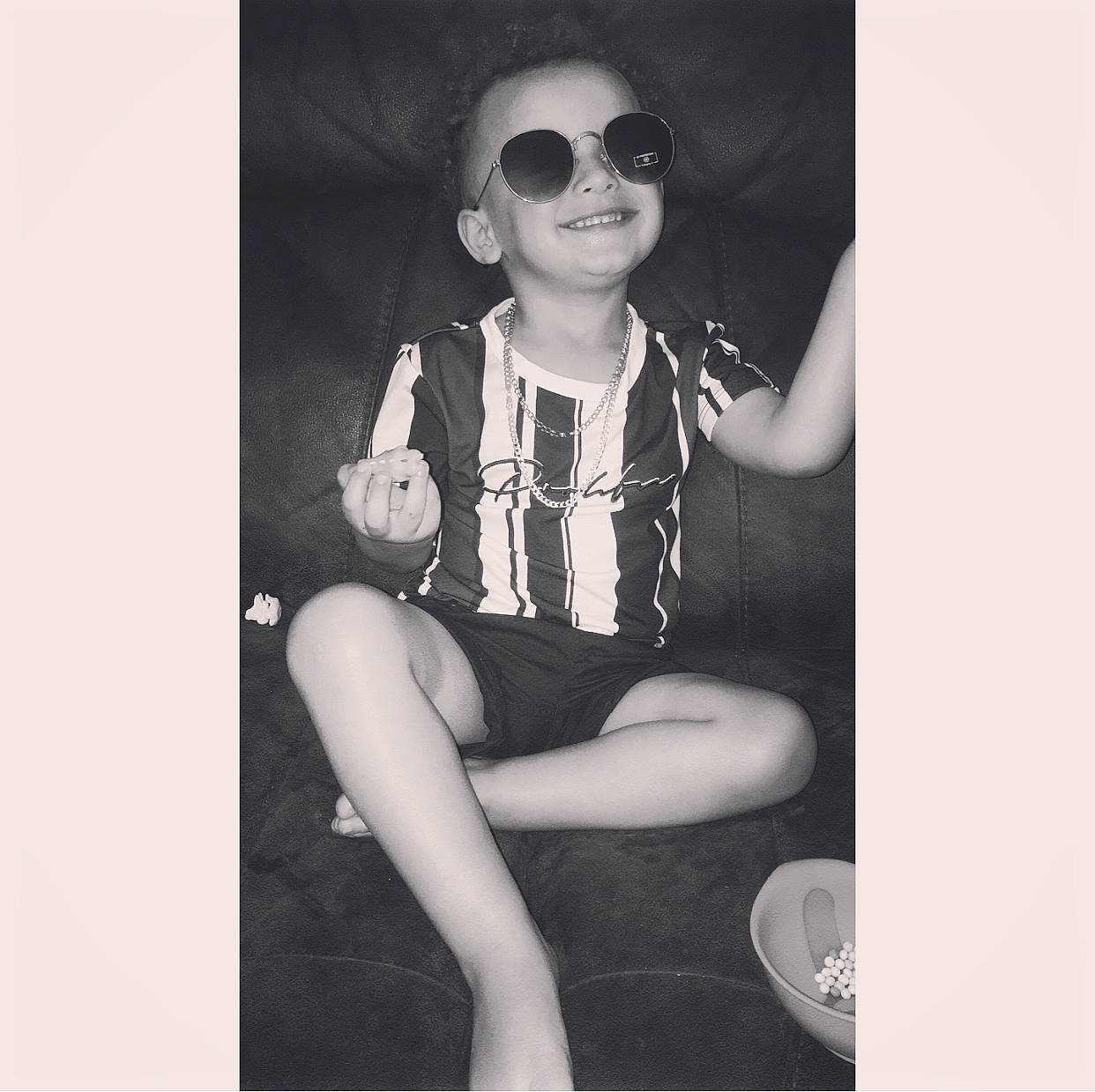 Teddie is registered to the contest to win money with this photo: beauty, black, black_and_white, child, cool, eyewear, fashion, glasses, hand, joint, joy, leg, monochrome, person, photograph, photography, shoulder, sitting, snapshot, sunglasses