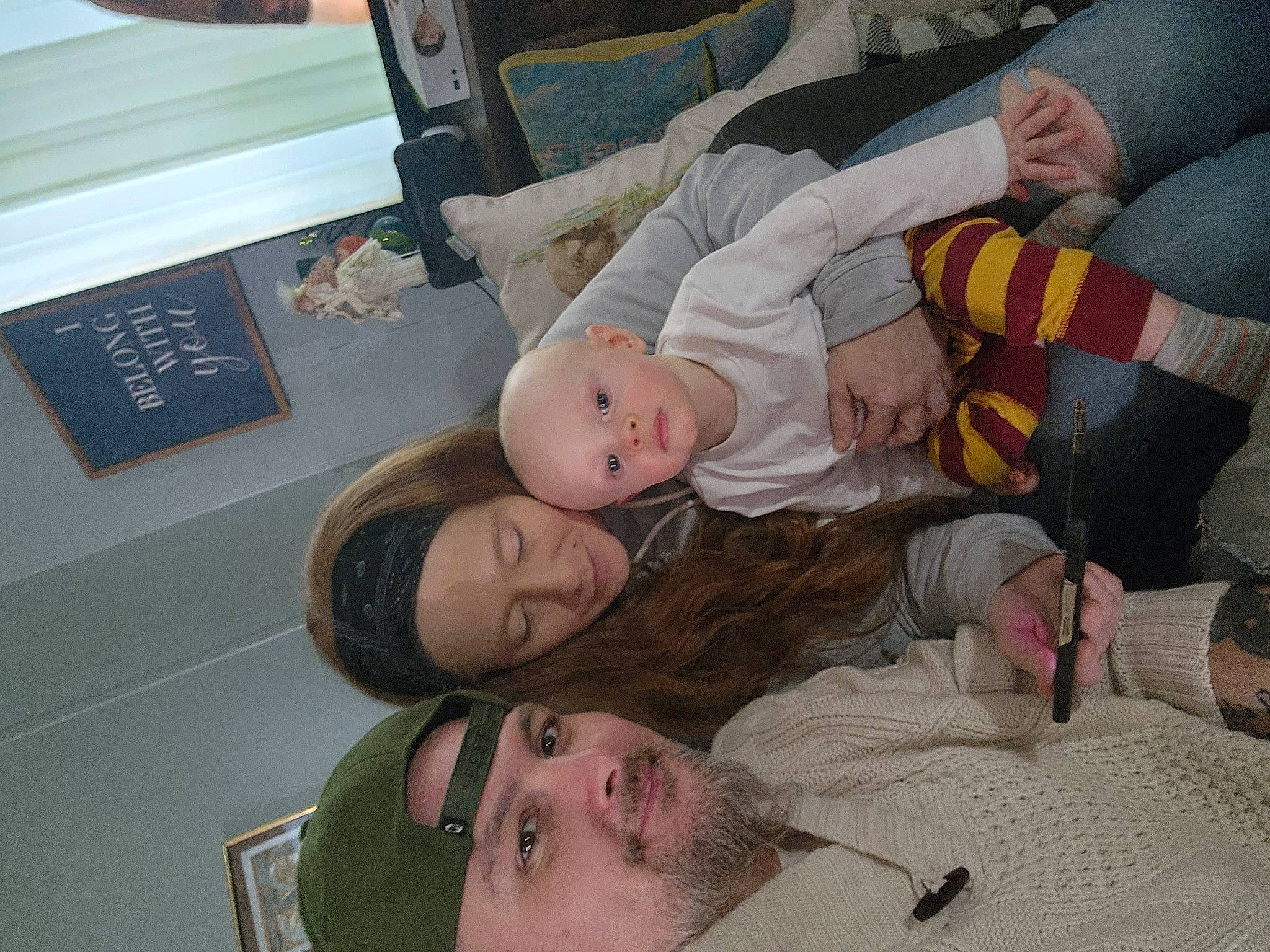 Robert is registered to the contest to win money with this photo: baby, baby_products, baby_toddler_clothing, child, comfort, event, fun, happy, hat, headwear, joy, lap, linens, person, room, smile, toddler