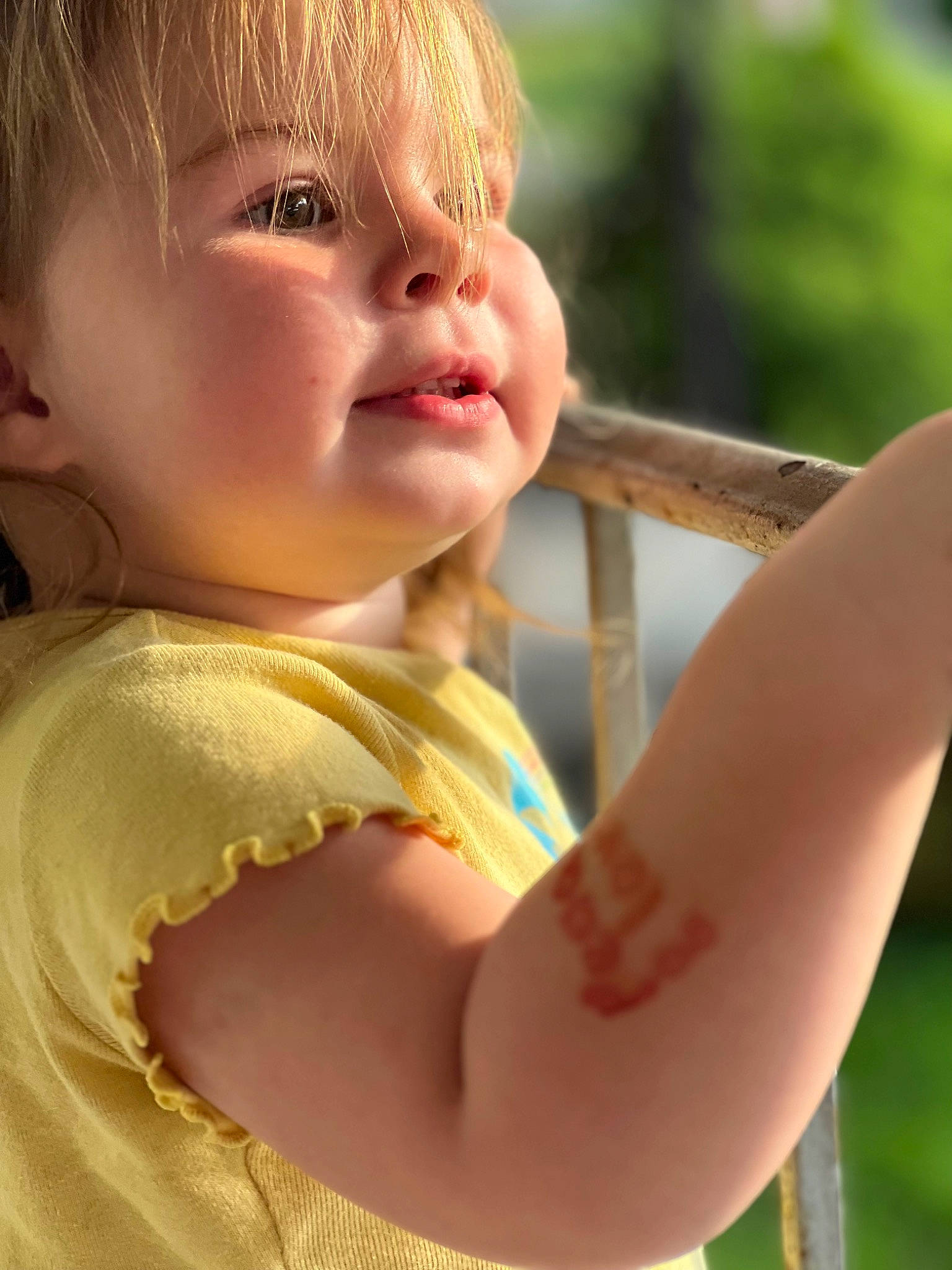 Stormi is registered to the contest to win money with this photo: arm, baby_toddler_clothing, beauty, chin, elbow, finger, gesture, grass, happy, head, human_body, lip, nose, people_in_nature, person, shoulder, skin, smile, summer, toddler