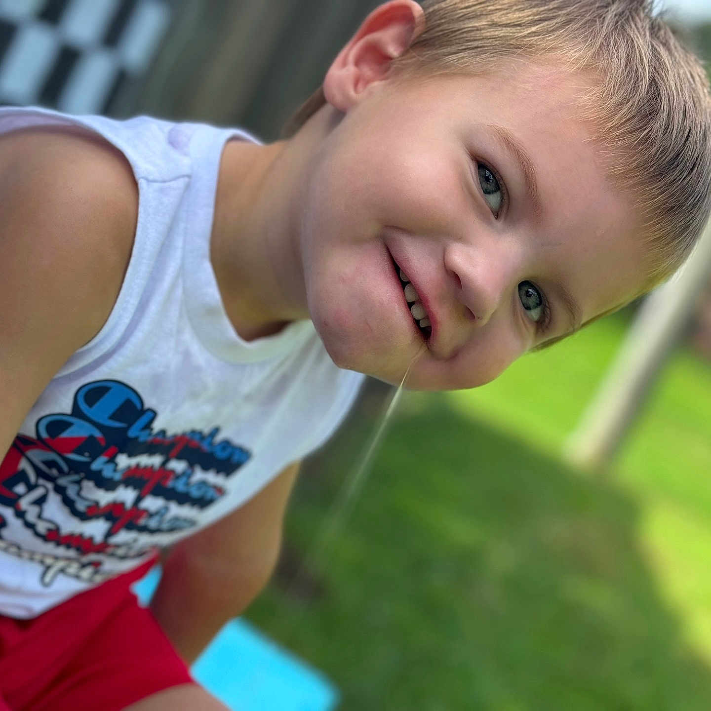 Kailor is registered to the contest to win money with this photo: bodypart, boy, child, clothing, face, finger, grass, hand, head, lawn, male, outdoors, person, photography, plant, portrait, summer, t_shirt, tanktop, water