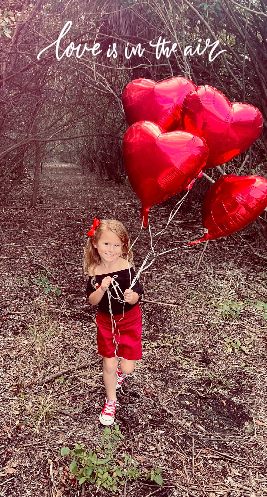 Sophia is registered to the contest to win money with this photo: balloon, beauty, boot, child, fashion_accessory, flower, fun, grass, happy, joy, magenta, natural_environment, natural_landscape, party_supply, people_in_nature, person, petal, pink, plant, soil