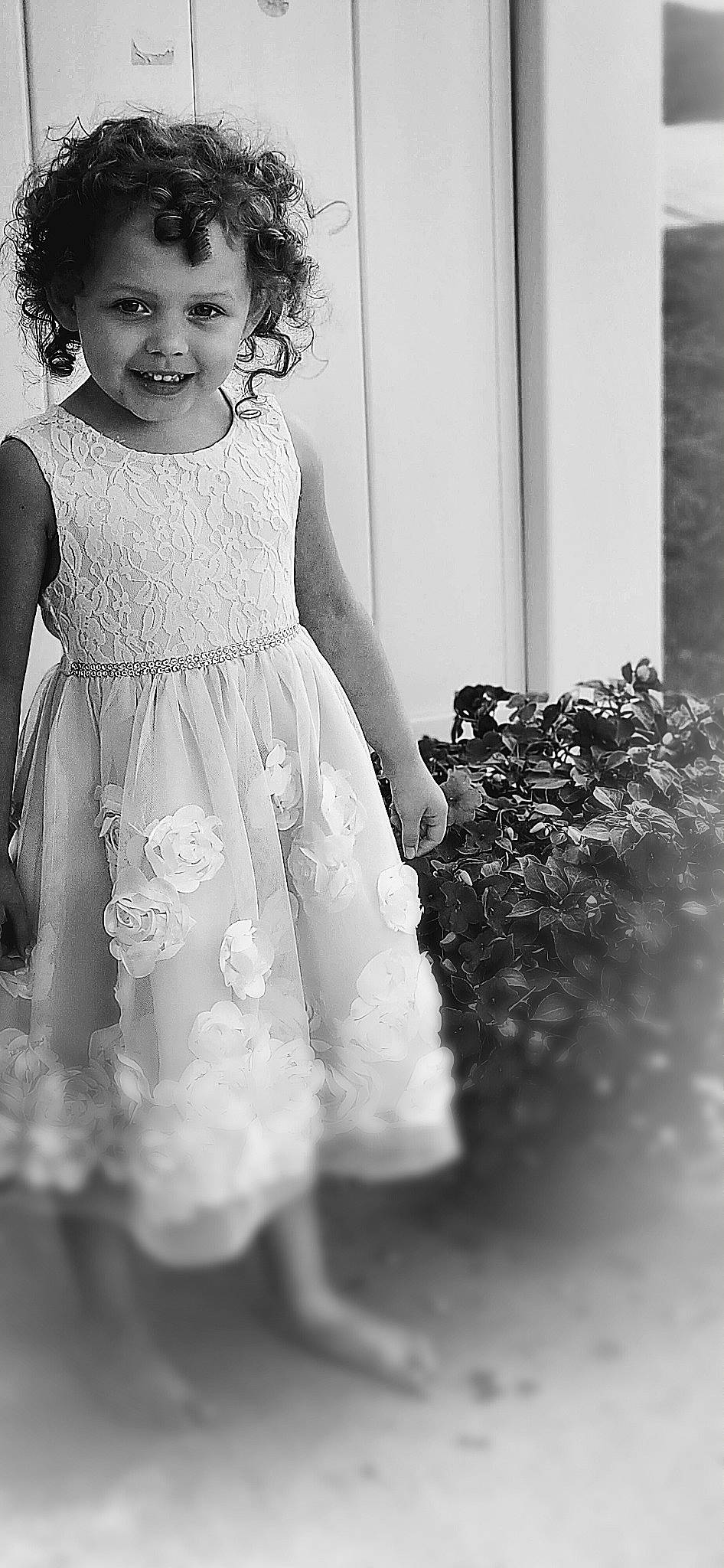 Kenzie is registered to the contest to win money with this photo: black, black_and_white, day_dress, dress, eye, flash_photography, gesture, happy, human_body, iris, joy, one_piece_garment, person, photograph, shoulder, skin, smile, snapshot, style, toddler