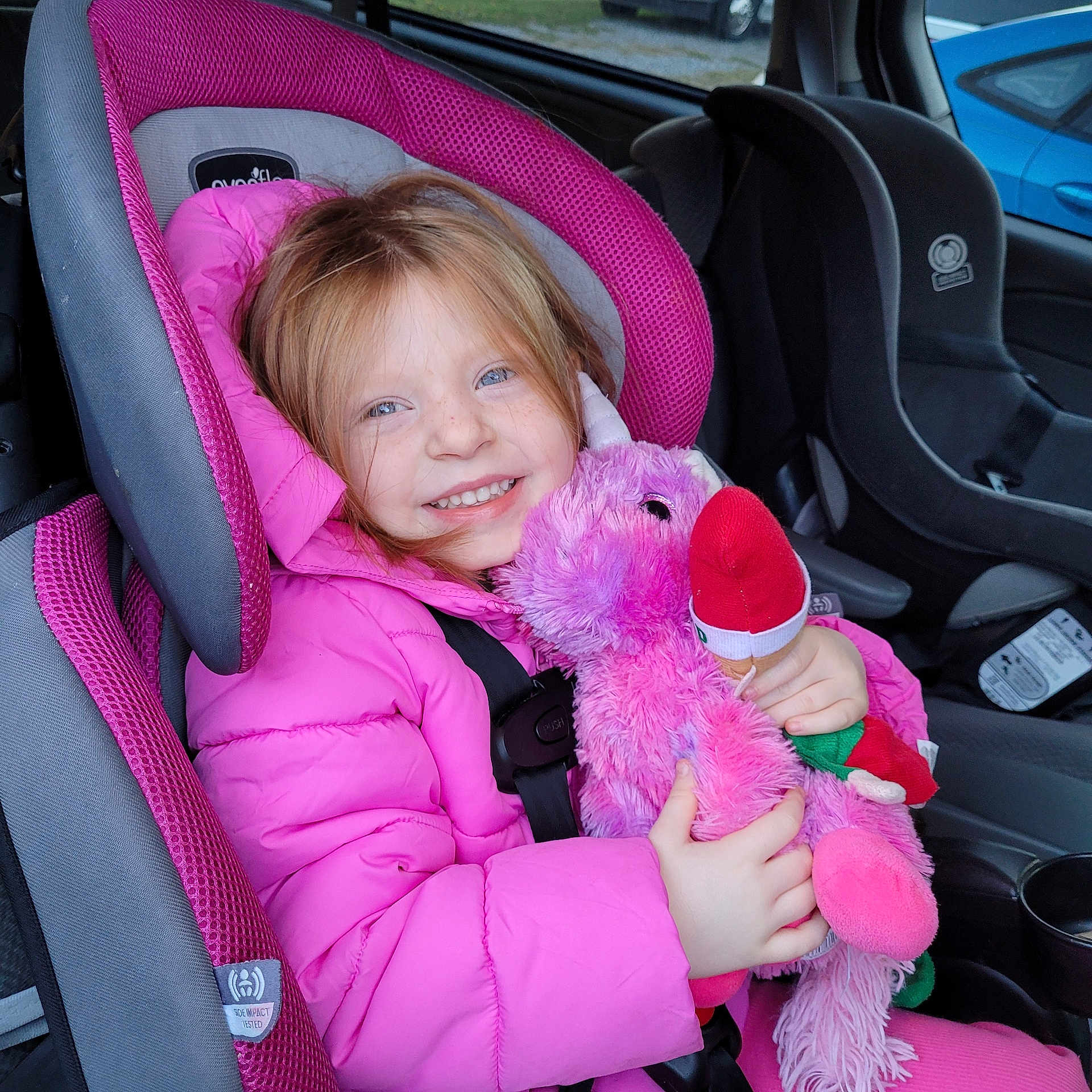 Alayna joined the competition — help win amazing prizes! baby, car, car_interior, carseat, clothing, coat, cushion, face, head, homedecor, jacket, machine, person, photography, portrait, purple, toy, transportation, vehicle, wheel