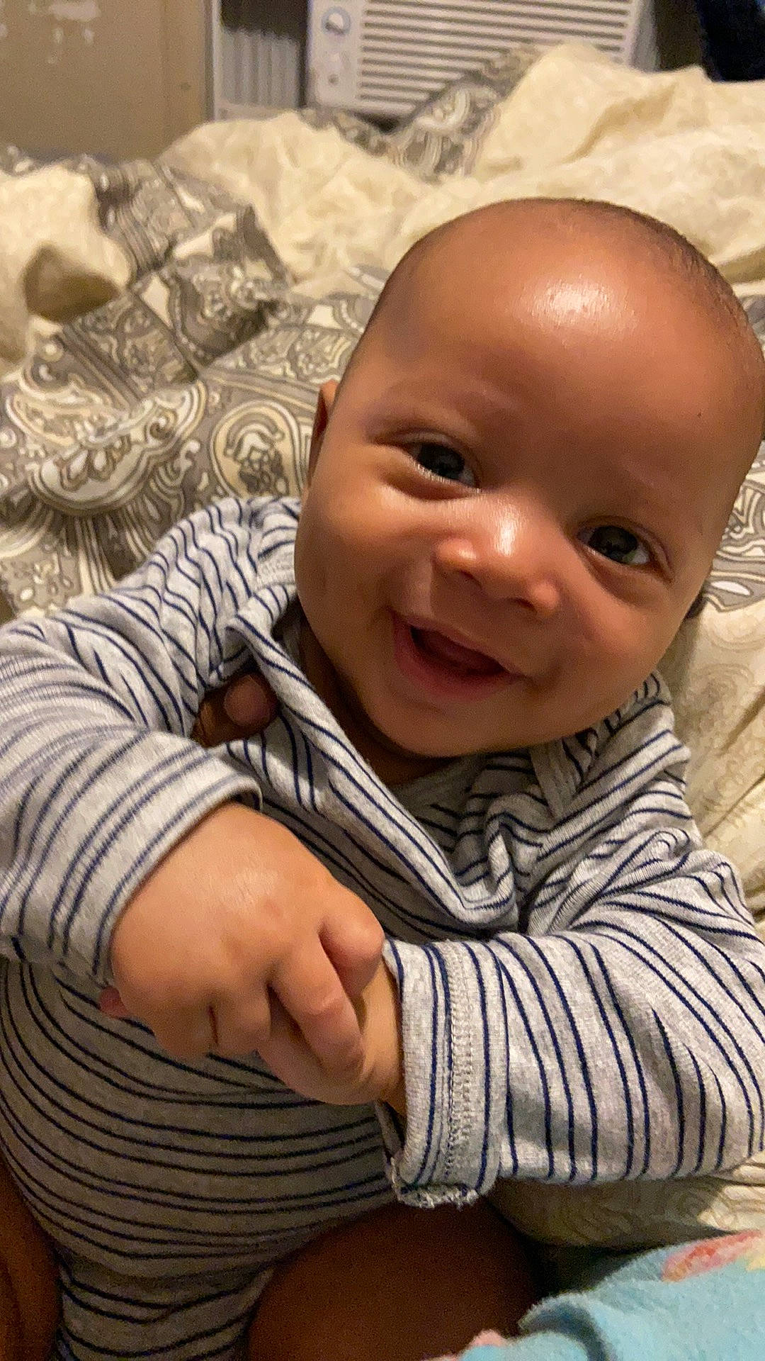 Atreus is registered to the contest to win money with this photo: baby, baby_toddler_clothing, brown, cheek, chin, clothing, comfort, finger, gesture, happy, head, iris, lip, mammal, mouth, nose, person, skin, sleeve, smile