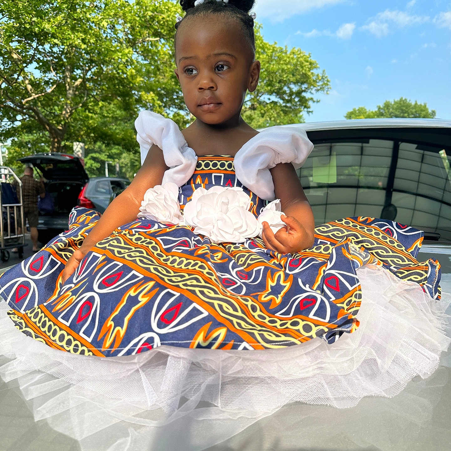 Lucia-Amari is registered to the contest to win money with this photo: car, child, clothing, costume, cream, dessert, dress, face, female, food, girl, head, icing, person, photography, portrait, sitting, skirt, summer, transportation