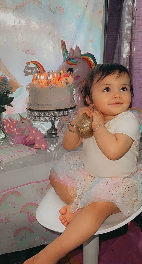 Blessing is registered to the contest to win money with this photo: baby_toddler_clothing, birthday, birthday_cake, cake, cake_decorating, cake_decorating_supply, chair, dessert, dress, event, food, happy, human_leg, icing, peach, person, pink, sugar_cake, sweetness, thigh