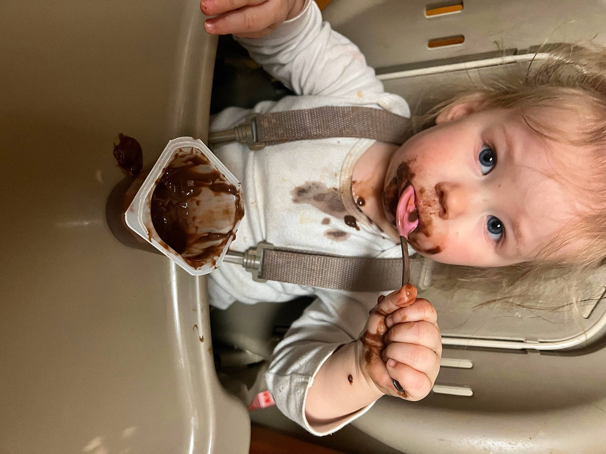 Kalliopè is registered to the contest to win money with this photo: baby, baby_products, baby_toddler_clothing, chair, cheek, child, comfort, drinkware, eyelash, finger, food, gesture, hand, happy, nail, nose, person, room, sitting, tableware