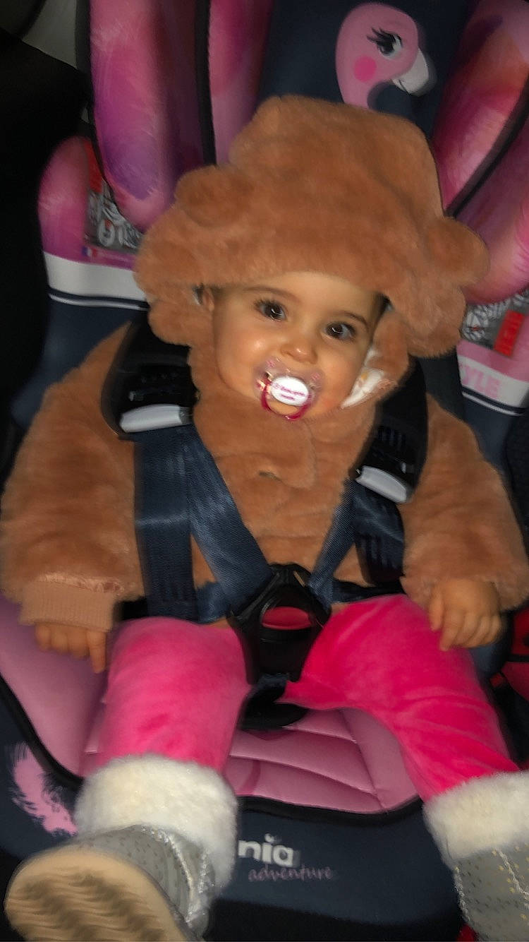 Sofya participe au concours pour gagner de l'argent avec cette photo : action_figure, cheek, child, costume, doll, fashion_accessory, fictional_character, fun, glove, headwear, joy, lap, lip, magenta, nail, person, pink, plastic, sitting, skin