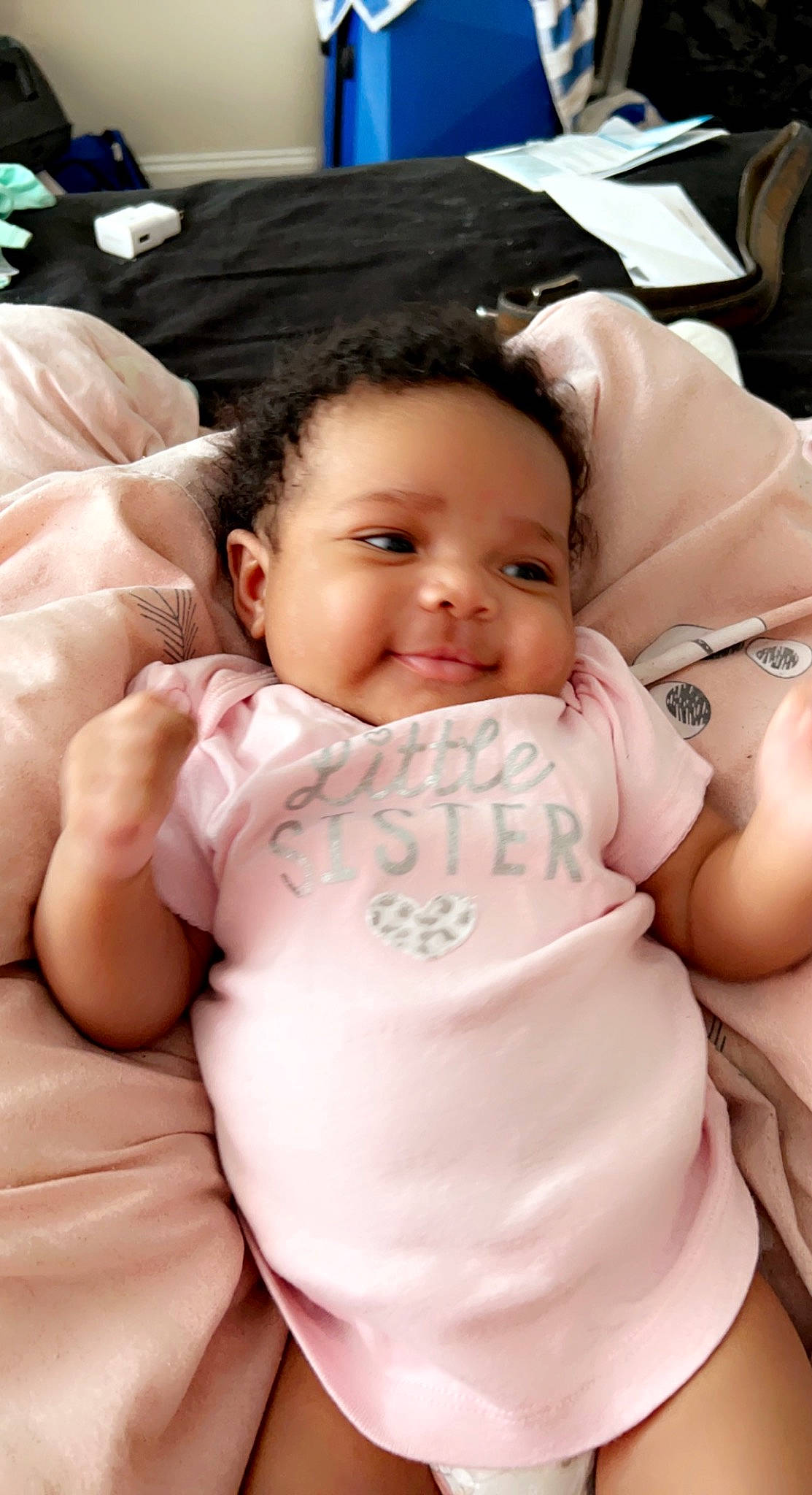 Aniya joined the competition — help win amazing prizes! abdomen, baby, cheek, child, comfort, facial_expression, finger, gesture, happy, linens, mouth, muscle, person, sitting, skin, smile, stomach, textile, thumb, toddler