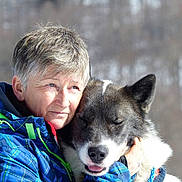 Naika participe au concours pour gagner de l'argent avec cette photo : affection, animal, closeup, cold_weather, dog, eyes_closed, face, happy, head, hug, jacket, love, nature, outdoor, person, pet, portrait, snow, warm_clothing, winter