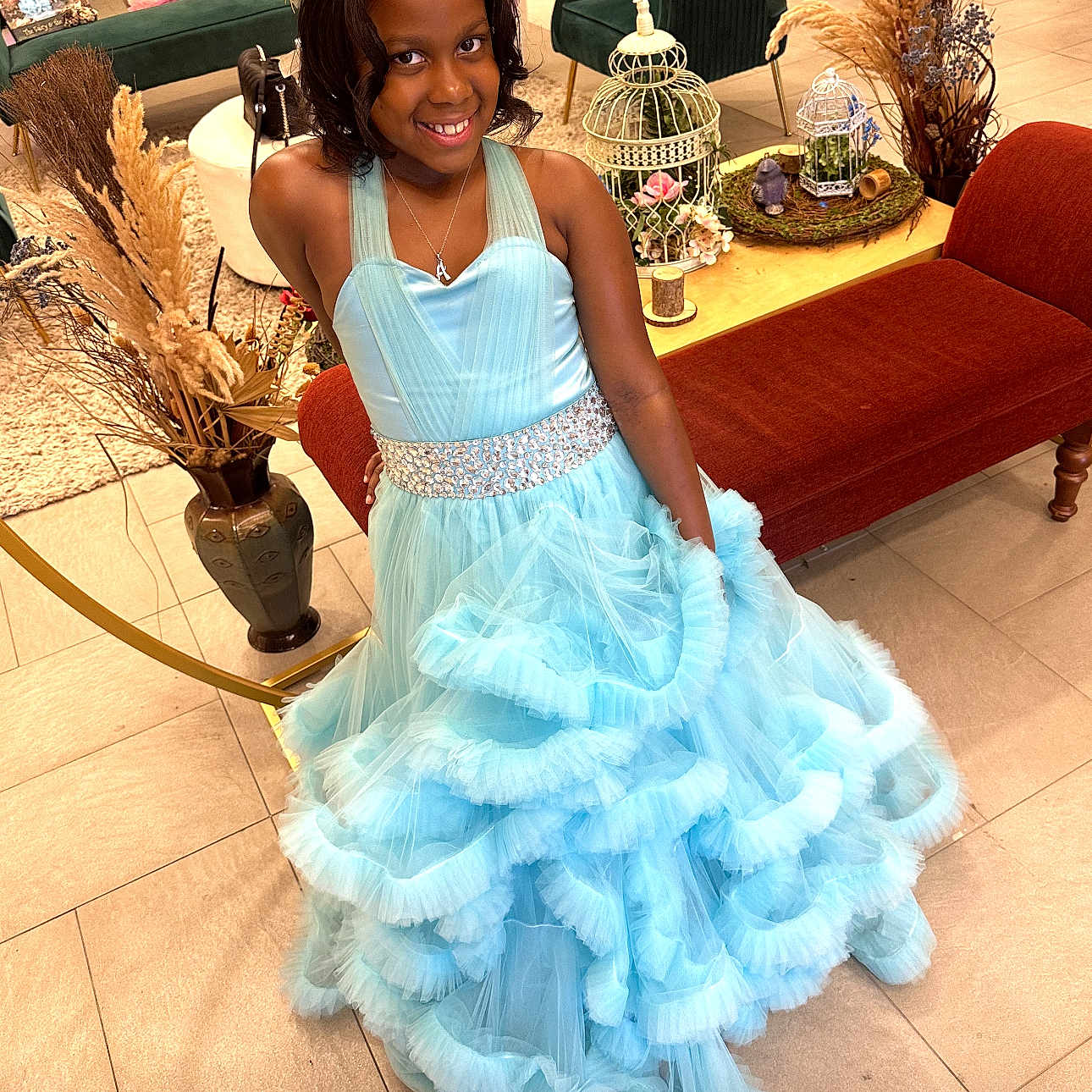 Amina Richmond is registered to the contest to win money with this photo: child, clothing, costume, couch, dress, face, fashion, female, flower, flowerarrangement, flowerbouquet, formalwear, furniture, gown, head, person, photography, plant, portrait, pottedplant