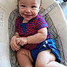 baby, baby_seat, blue_shorts, casual, child, cushion, cute, face, feet, hands, happy, indoor, infant, legs, person, playful, portrait, smiling, striped_shirt, young