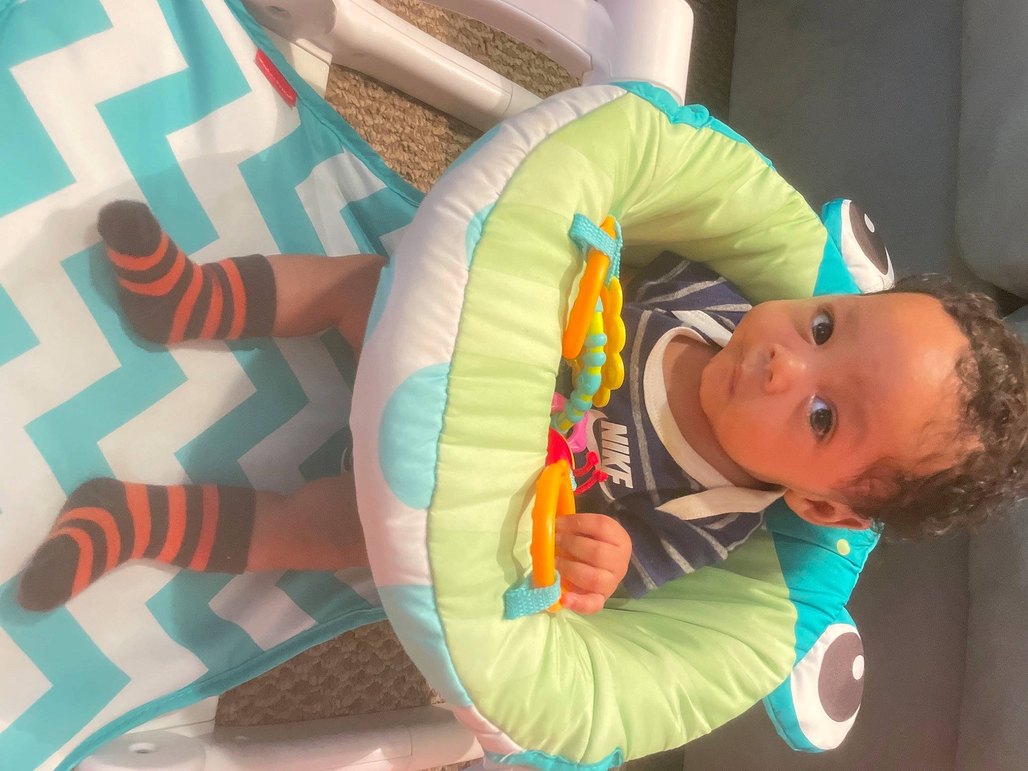 Giovanni is registered to the contest to win money with this photo: arm, baby, baby_playing_with_toys, baby_products, baby_toddler_clothing, baby_toys, chair, cheek, child, comfort, fun, head, leisure, person, play, room, sitting, stuffed_toy, textile, toddler
