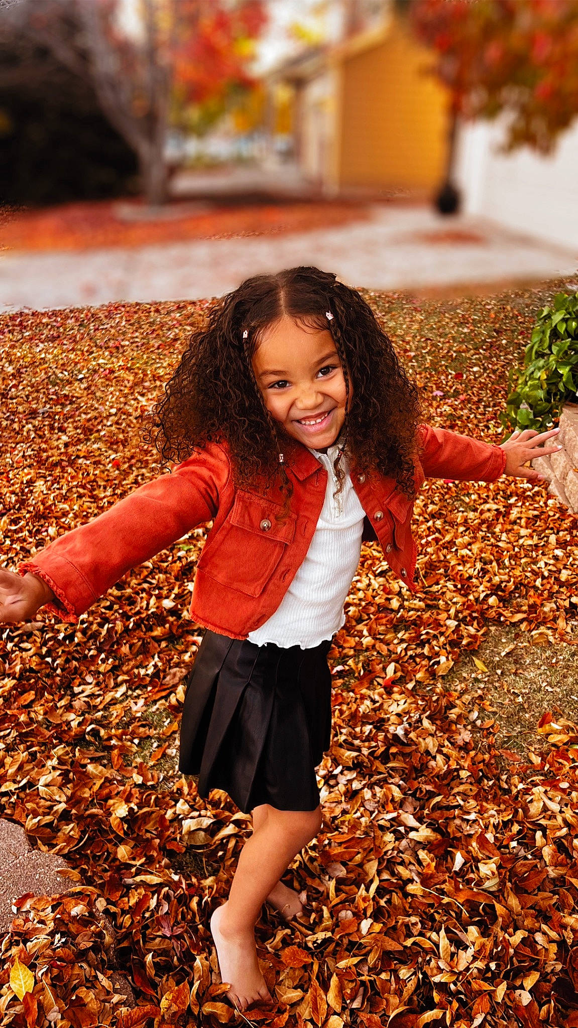 Aaliyah is registered to the contest to win money with this photo: child, facial_expression, flash_photography, grass, hair, hairstyle, happy, joy, leaf, leg, light, orange, people_in_nature, person, photograph, plant, smile, sunlight, thigh, waist