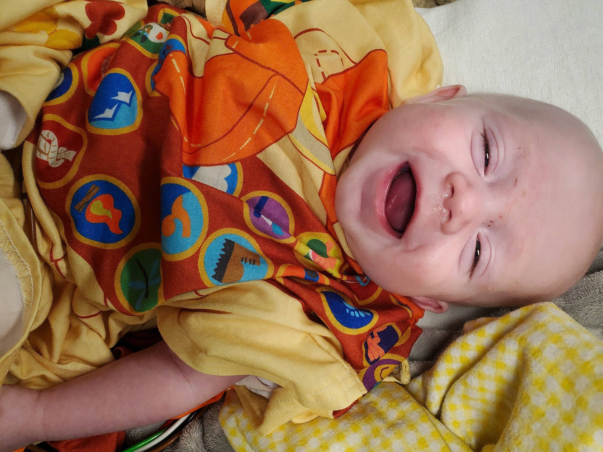 Zeke joined the competition — help win amazing prizes! baby, baby_toddler_clothing, cheek, comfort, eye, face, facial_expression, happy, head, human_body, mammal, mouth, nose, orange, person, product, skin, sleeve, smile, textile