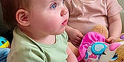 Imogen joined the competition — help win amazing prizes! baby, child, infant, toddler, sitting, indoor, toy, plush_toy, blue_eyes, cute, curious, couch, blanket, clothing, person, face, head, furniture, soft_toy, room