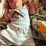 Jayce is registered to the contest to win money with this photo: baby, sleeping, infant, mickey_mouse, clothing, onesie, blanket, patterned, colorful, cute, cozy, toddler, bed, resting, child, soft, home, comfort, happy, easter