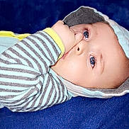 Elias joined the competition — help win amazing prizes! baby, blanket, blue_eyes, child, comfort, cute, face, hoodie, indoors, infant, lying_down, portrait, resting, skin, sleepwear, soft_texture, striped_clothing, thumb_in_mouth, warm_clothing, young_child