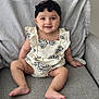baby, bodypart, chair, clothing, couch, cushion, dress, face, finger, furniture, hand, happy, head, homedecor, pants, person, photography, portrait, sitting, smile