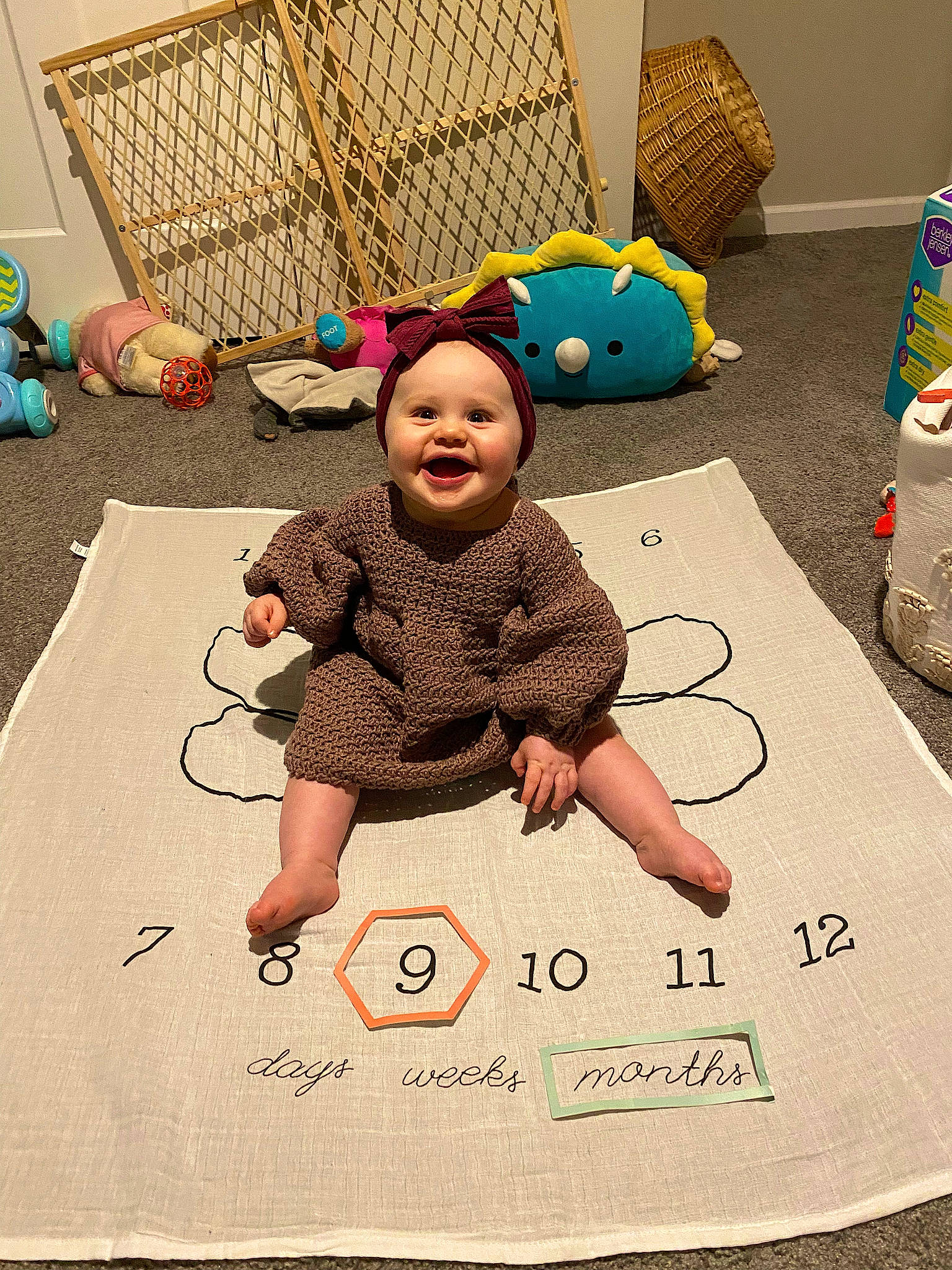 Nora is registered to the contest to win money with this photo: art, baby, baby_toddler_clothing, child, child_art, comfort, drawing, flooring, font, fun, headwear, joy, leisure, pattern, person, play, product, room, stuffed_toy, t_shirt