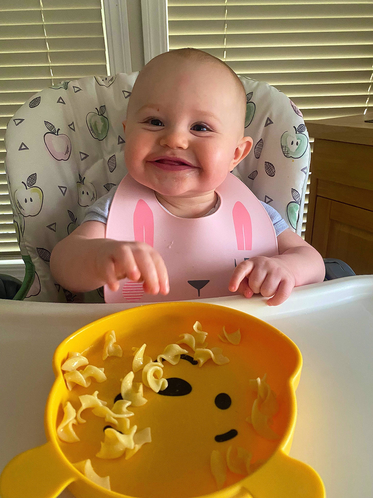 Nora joined the competition — help win amazing prizes! baby, baby_food, baby_laughing, baby_playing_with_toys, baby_products, baby_safety, baby_toddler_clothing, baby_toys, cheek, child, comfort_food, dishware, drinkware, facial_expression, happy, joy, person, smile, sweetness, table
