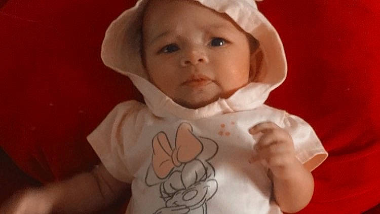 Kaia joined the competition — help win amazing prizes! baby, baby_toddler_clothing, cap, cheek, ear, eye, eyebrow, eyelash, face, finger, gesture, happy, headwear, human_body, iris, lip, mouth, nose, person, skin