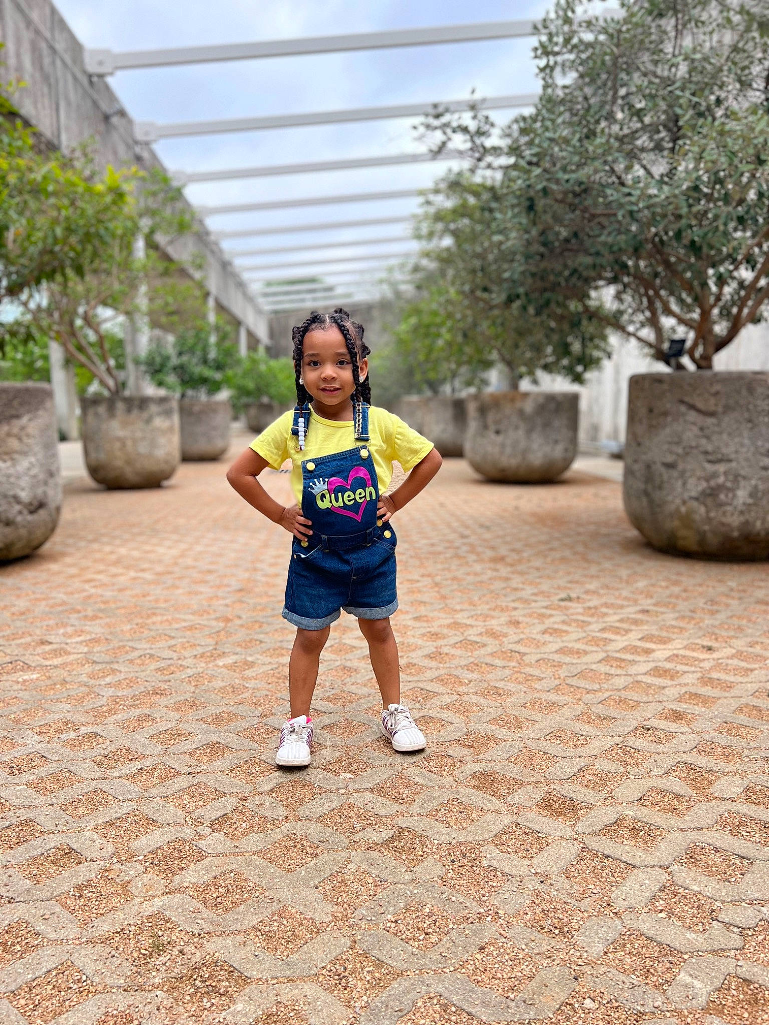 Amalia is registered to the contest to win money with this photo: asphalt, baby, child, electric_blue, flooring, fun, grass, happy, headwear, joy, landscape, leisure, person, plant, recreation, road, road_surface, shorts, spring, t_shirt