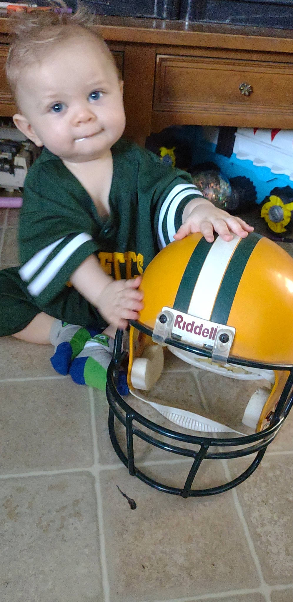 Randall joined the competition — help win amazing prizes! automotive_exterior, baby, baby_products, baby_toddler_clothing, bag, child, fun, helmet, motor_vehicle, motorcycle_helmet, person, personal_protective_equipment, photography, product, sitting, smile, snapshot, sports_gear, t_shirt, toddler