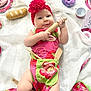 Judyth a rejoint le concours — aidez-le/la à gagner de superbes lots ! baby, infant, headband, flower, apron, toy_food, rolling_pin, playtime, cute, smile, white_cloth, pink, green, child, kitchen_toys, soft_toys, plate, spoon, cookie, bread