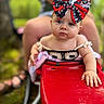Oakley joined the competition — help win amazing prizes! baby, child, bow, red_toy_car, outdoor, blurred_background, person, blue_eyes, hand, face, summer, cute, infant, clothing, playtime, closeup, expression, skin, nature, sitting