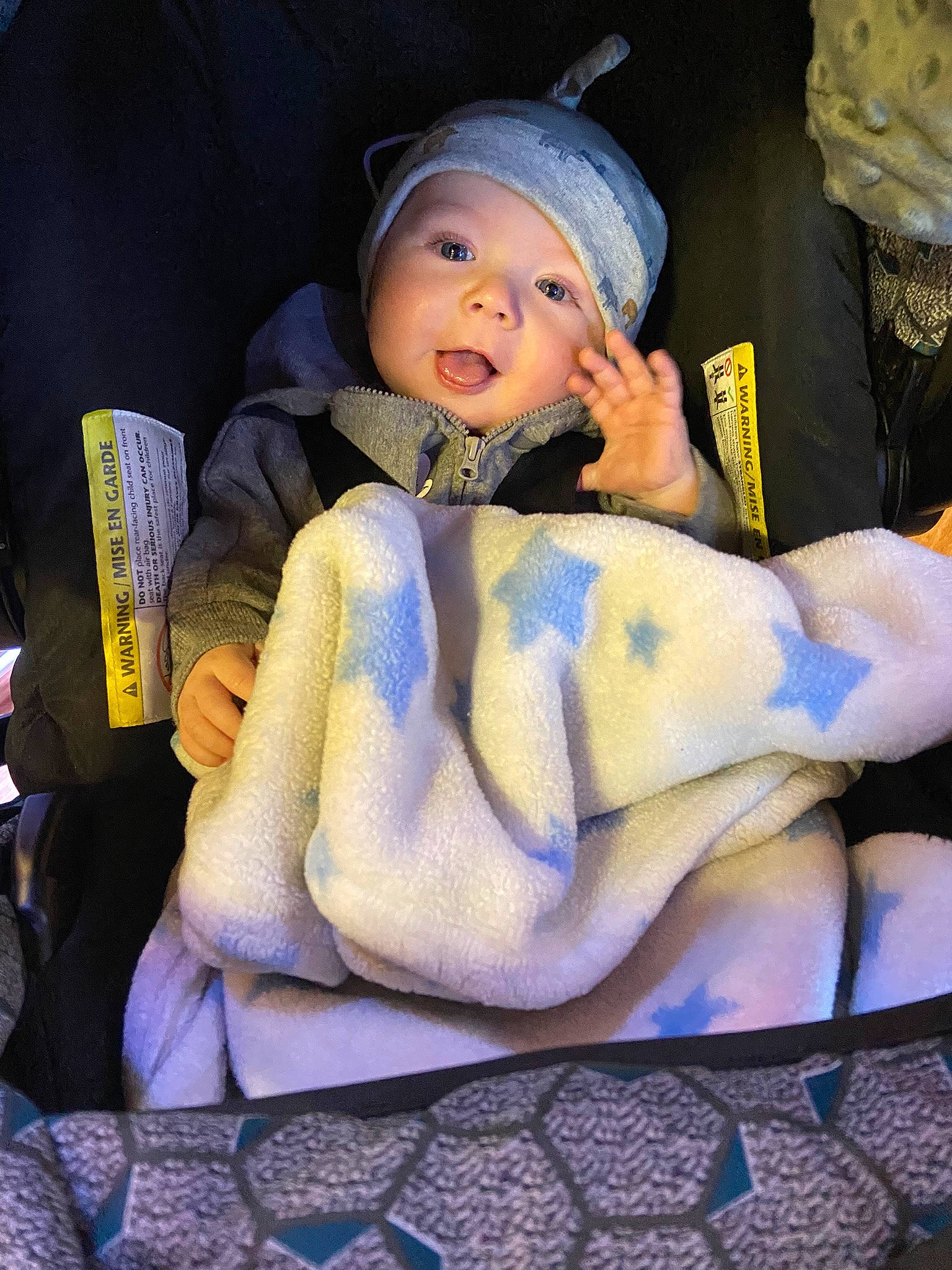 Jayden is registered to the contest to win money with this photo: baby, baby_carriage, baby_in_car_seat, baby_products, baby_toddler_clothing, beanie, cap, car_seat, chair, child, comfort, electric_blue, fashion_accessory, fun, headwear, lap, linens, person, purple, room