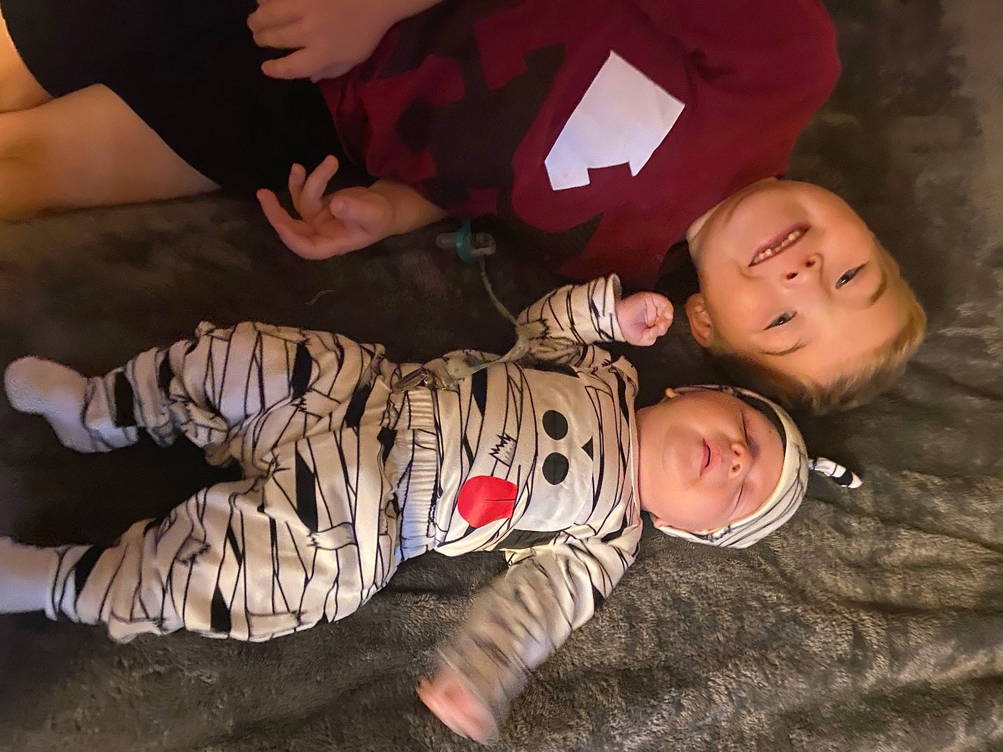 Jaxson is registered to the contest to win money with this photo: baby, baby_toddler_clothing, cheek, child, comfort, flash_photography, flooring, fun, grass, happy, hat, headwear, joy, pattern, person, room, sitting, sleeve, smile, t_shirt