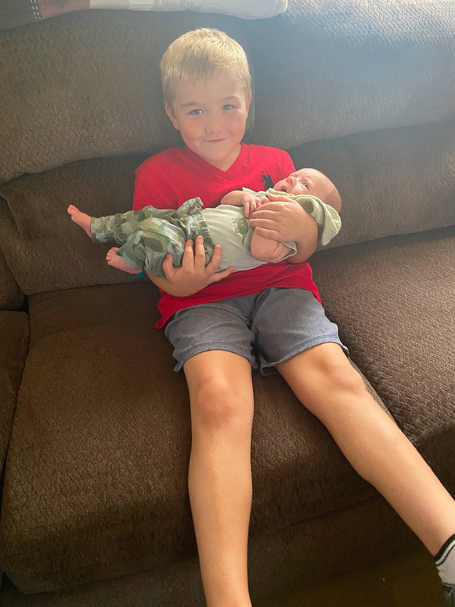 Jaxson joined the competition — help win amazing prizes! barefoot, comfort, couch, elbow, finger, happy, head, human_body, joint, knee, lap, leg, person, shorts, shoulder, sneakers, stomach, thigh, toddler, trunk