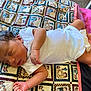 Jarvis is registered to the contest to win money with this photo: baby, newborn, sleeping, infant, onesie, quilt, patterned, indoor, peaceful, resting, child, toddler, blanket, closeup, soft, cute, skin, young, relaxing, portrait