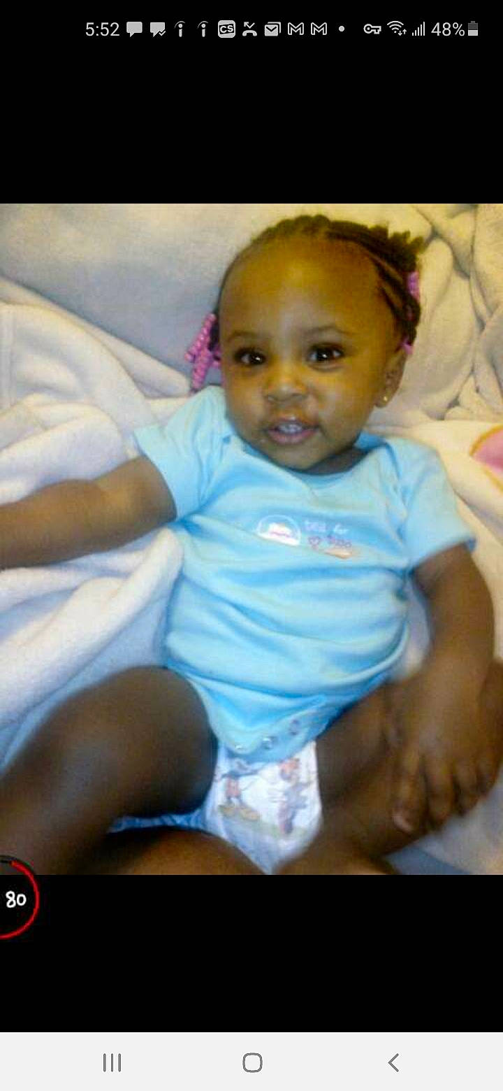 Amiyah joined the competition — help win amazing prizes! abdomen, baby, baby_products, baby_toddler_clothing, cheek, comfort, face, flash_photography, fun, gesture, happy, iris, linens, lip, mouth, nose, person, sitting, smile, t_shirt