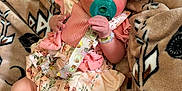 Harper joined the competition — help win amazing prizes! baby, blanket, bow, child, cozy, cute, floral_dress, headband, indoors, infant, newborn, pacifier, peaceful, person, resting, sleeping, small_hands, sock, soft_texture, wrapped