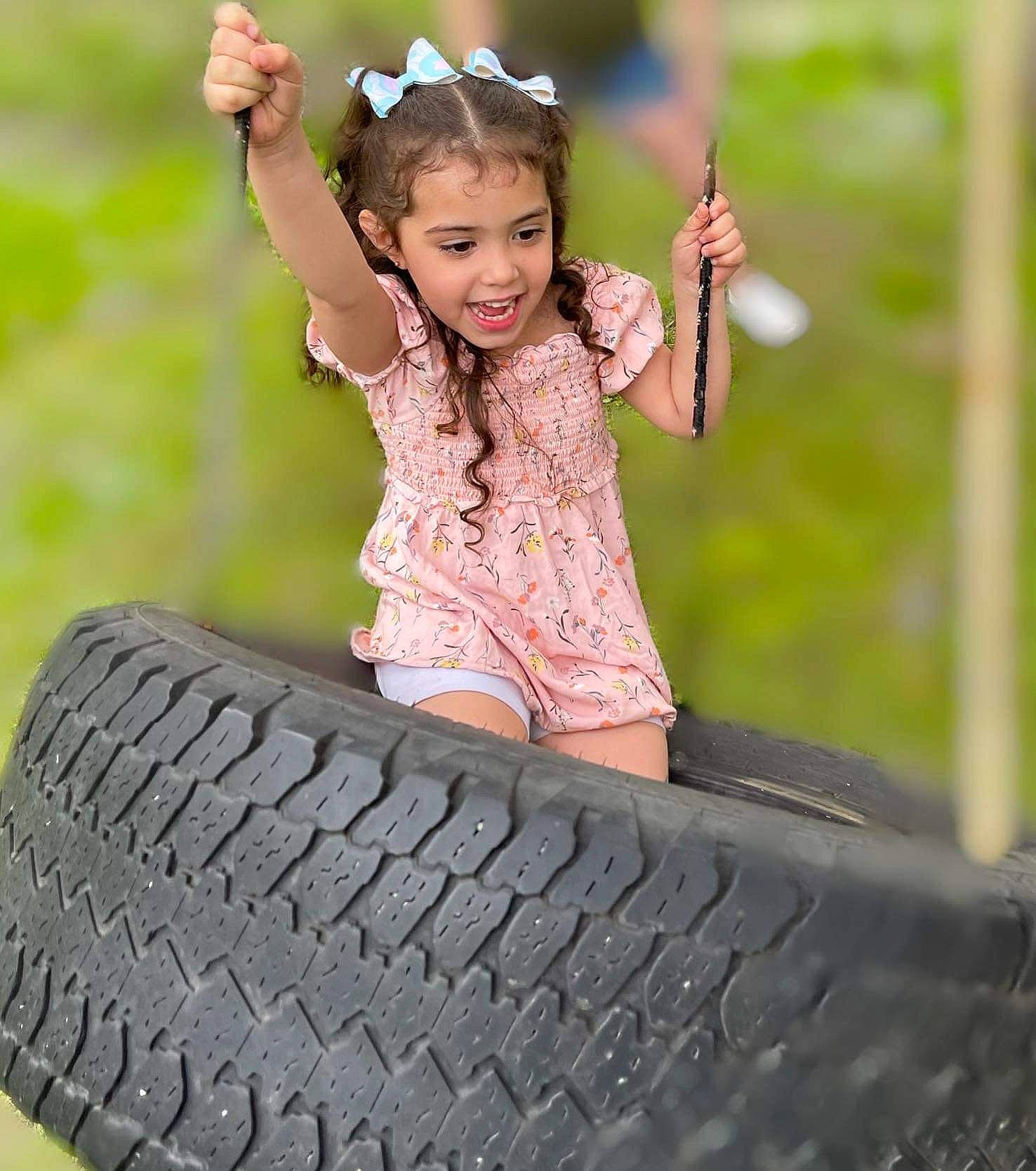 Piper joined the competition — help win amazing prizes! auto_part, automotive_tire, bumper, eye, face, flash_photography, grass, happy, leisure, people_in_nature, person, plant, rim, smile, synthetic_rubber, tire, tire_care, toddler, tread, tree
