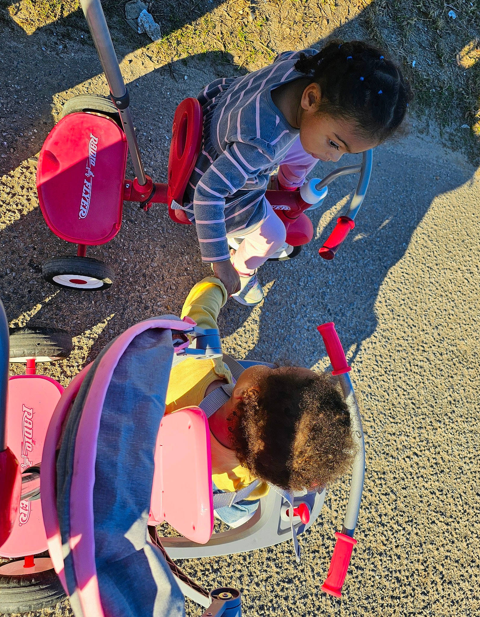Annalise is registered to the contest to win money with this photo: carmine, child, city, fashion_accessory, fun, grass, landscape, leisure, luggage_and_bags, pattern, person, play, recreation, sand, shadow, snapshot, soil, toddler, tree, vacation