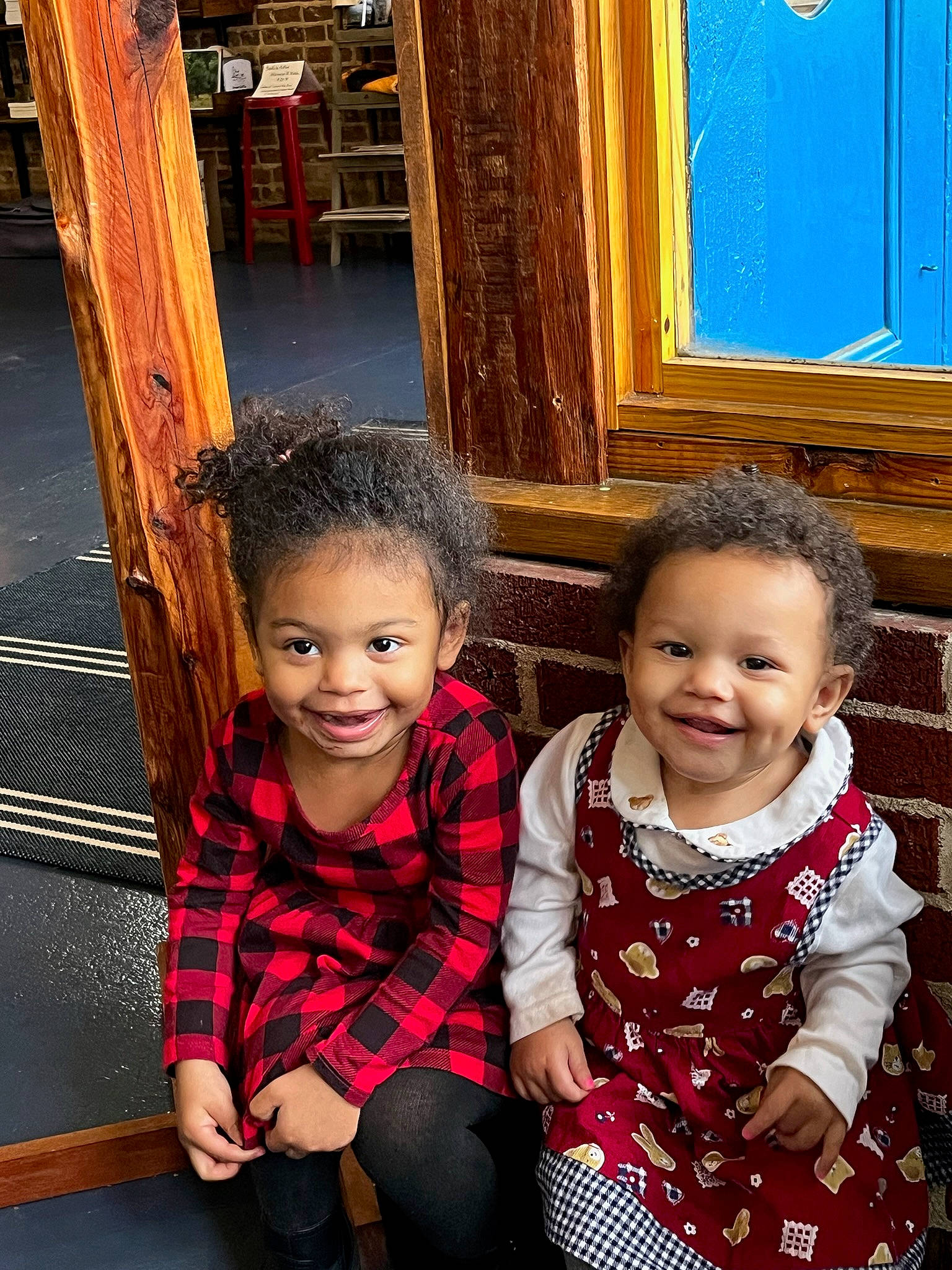 Annalise is registered to the contest to win money with this photo: baby_toddler_clothing, child, chin, event, face, friendship, fun, hairstyle, happy, joy, leisure, person, photograph, red, sitting, smile, snapshot, standing, tartan, toddler