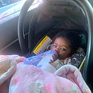 Thema-Barbara joined the competition — help win amazing prizes! baby, blanket, bottle, car, car_seat, child, clothing, comfort, face, hand, indoors, infant, milk, pink, portrait, relaxation, seatbelt, soft, sunlight, window