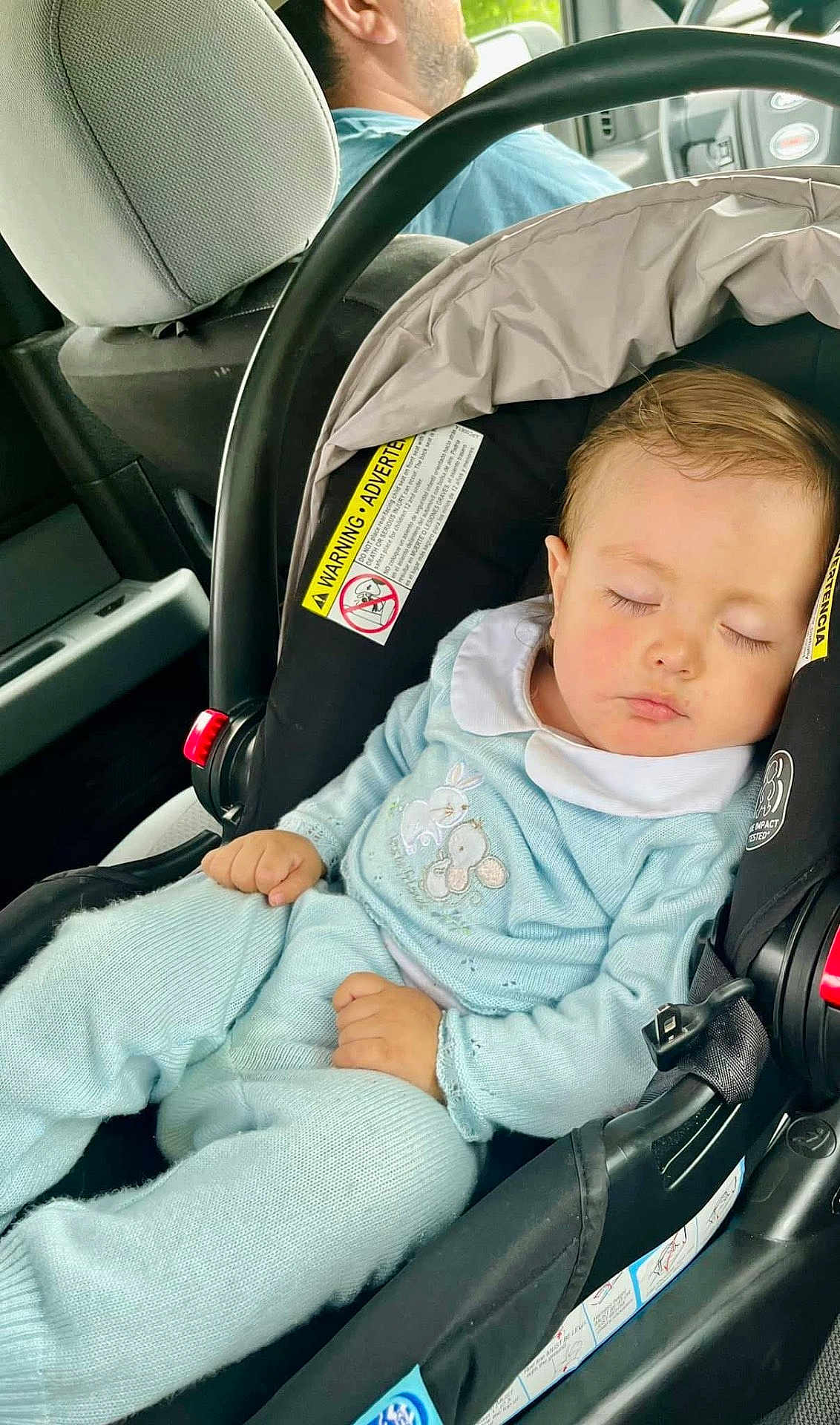 Carlos is registered to the contest to win money with this photo: baby, sleeping, car_seat, child, infant, blue_clothing, seatbelt, car_interior, person, head, closed_eyes, hand, sitting, transportation, safety, cute, peaceful, travel, young_child, portrait