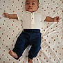 baby, infant, lying_down, white_shirt, navy_pants, patterned_sheet, arms_spread, barefoot, face, head, skin, child, person, indoors, cute, young, portrait, expression, sleepwear, bed