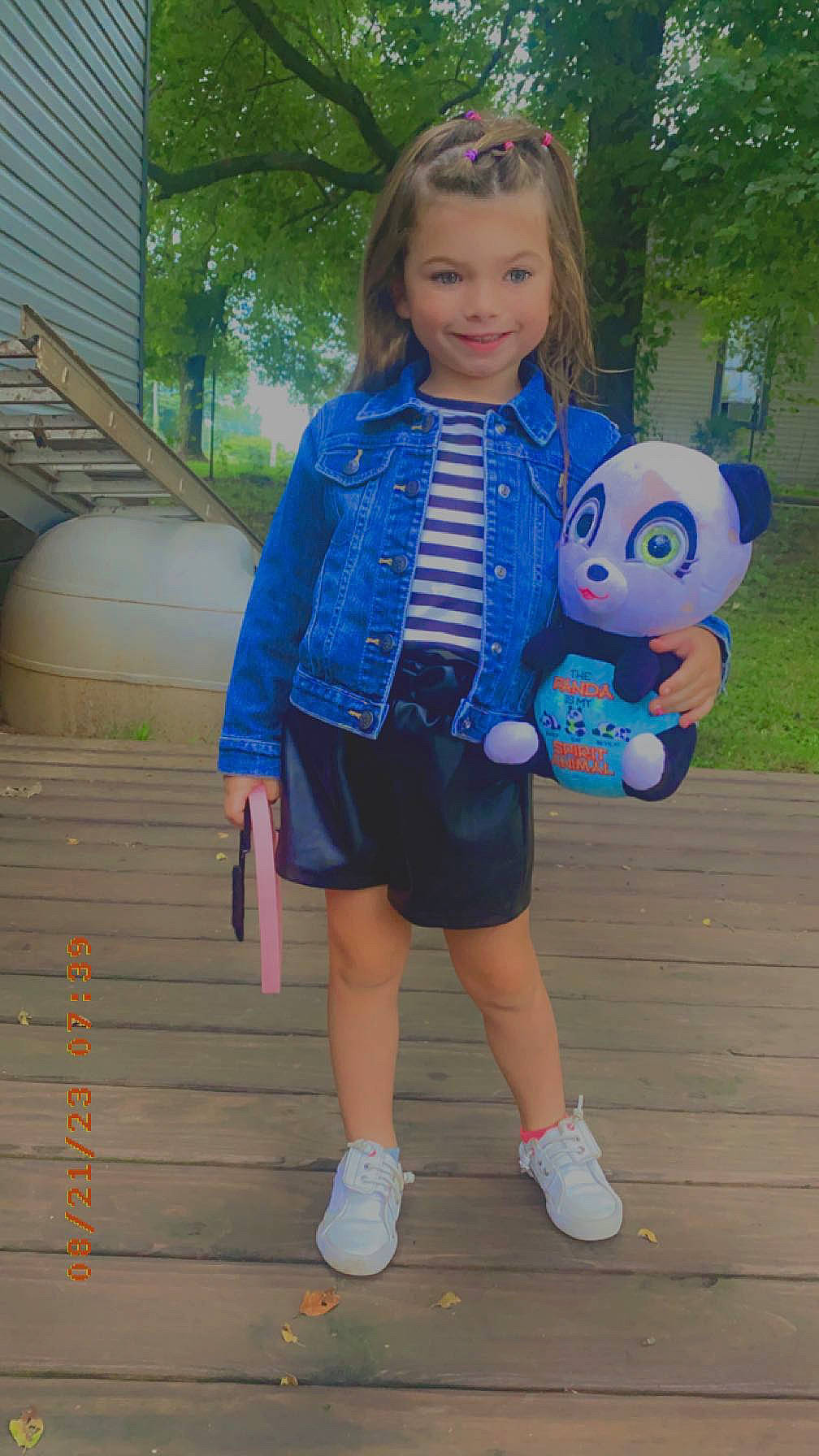 Zariah is registered to the contest to win money with this photo: child, denim, electric_blue, fun, grass, hair, happy, head, human_leg, joy, leisure, pattern, person, pink, recreation, shoe, sleeve, smile, sunglasses, t_shirt